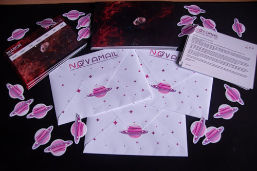 Novamail mail club with pink planet stickers scattered around on a black background